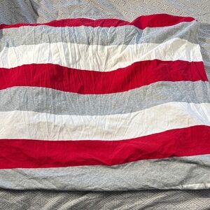 Two identical burts bees organic cotton crib sheets, one with small hole